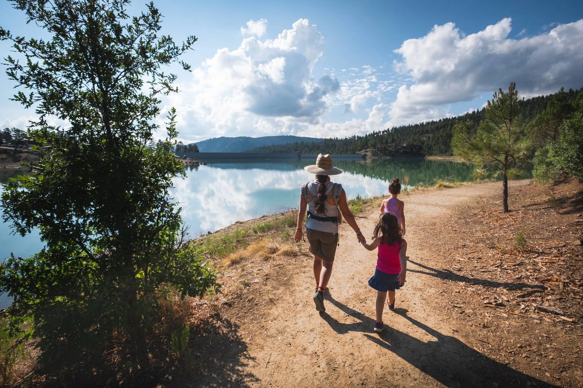 Walkers on the shoreline trail at Grindstone Lake