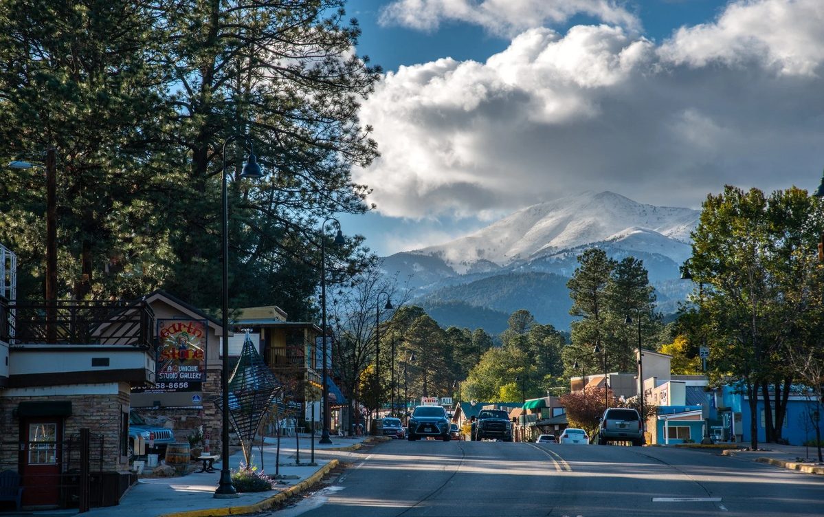 Sierra Blanca rising over Midtown Ruidoso under spring cloud